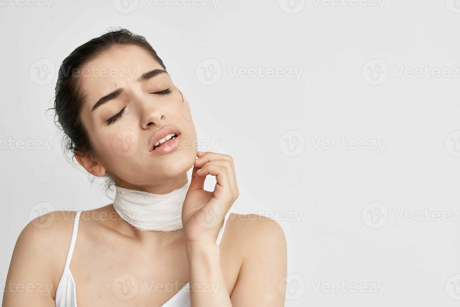 brunette holding his head trauma health problems isolated background photo