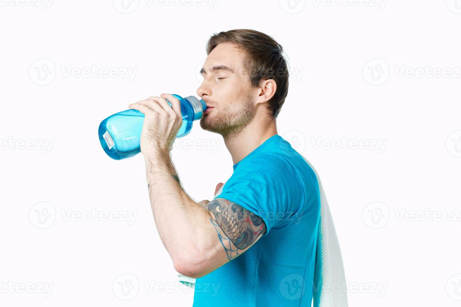 sport man in blue t-shirt water bottle thirst cropped view photo