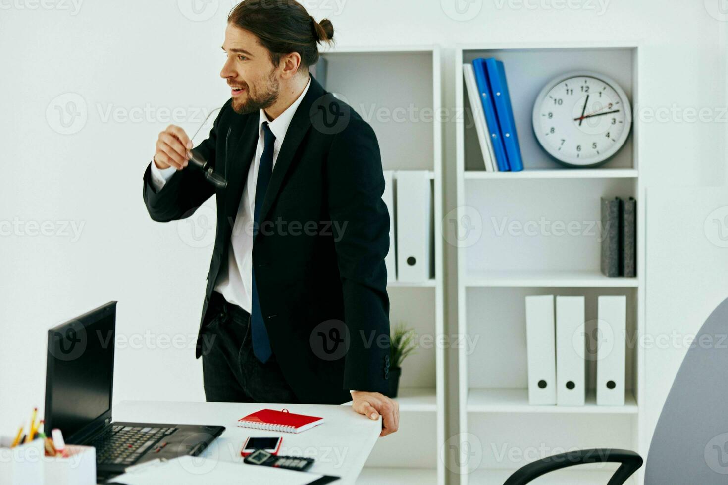 man in a suit holding a phone telephone office executive photo