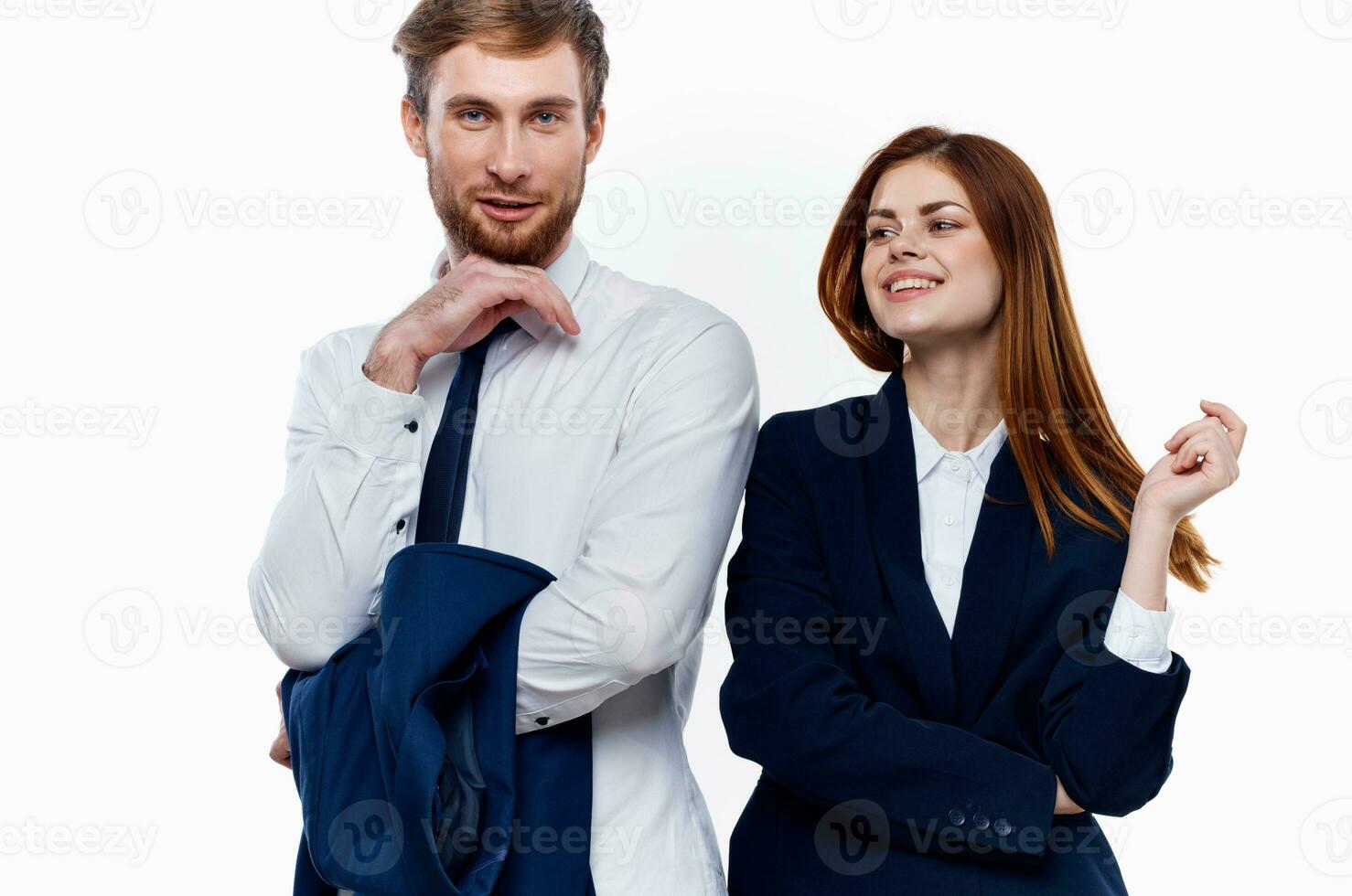 man and woman standing side by side cropped view light background photo