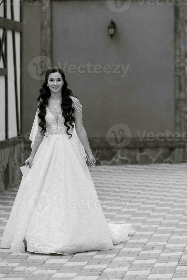 the first meeting of the bride and groom in the courtyard of the hotel photo