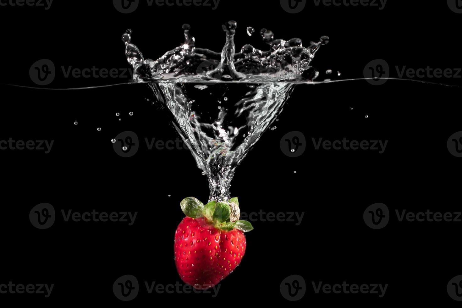 Fresh Strawberries with water splash photo
