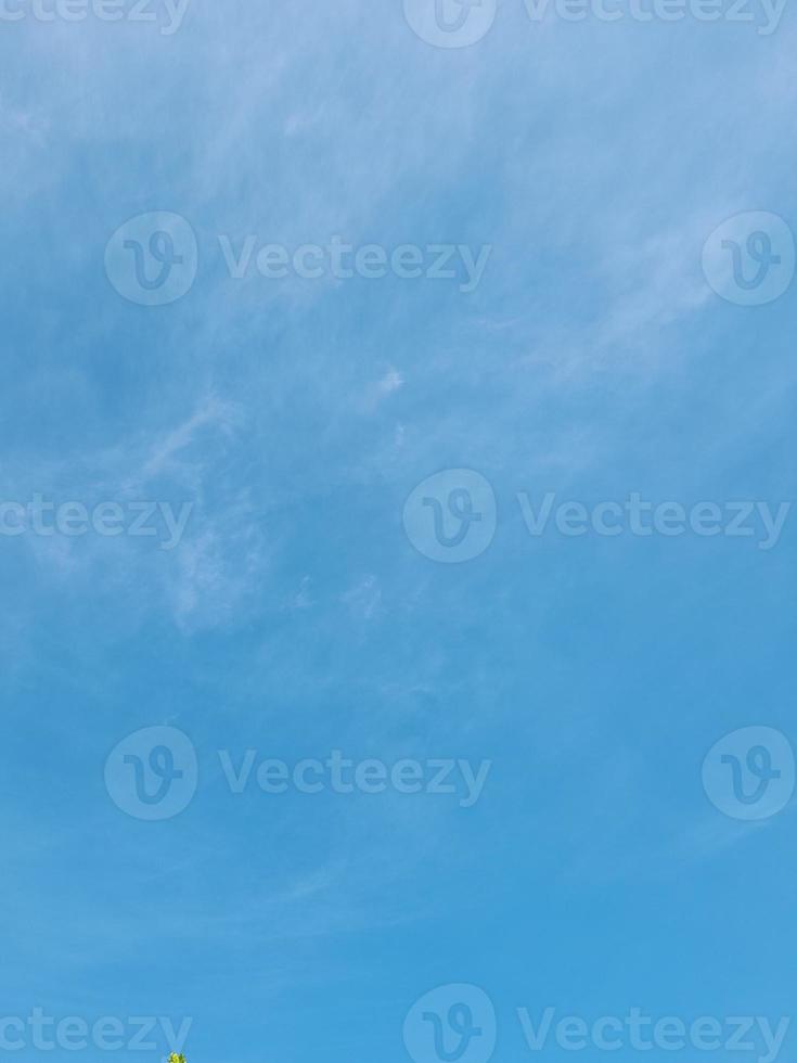 Beautiful white clouds on deep blue sky background. Large bright soft fluffy clouds are cover the entire blue sky. photo