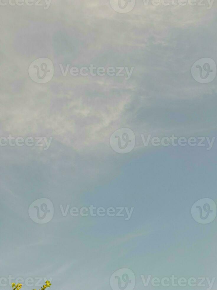 Beautiful white clouds on deep blue sky background. Large bright soft fluffy clouds are cover the entire blue sky. photo