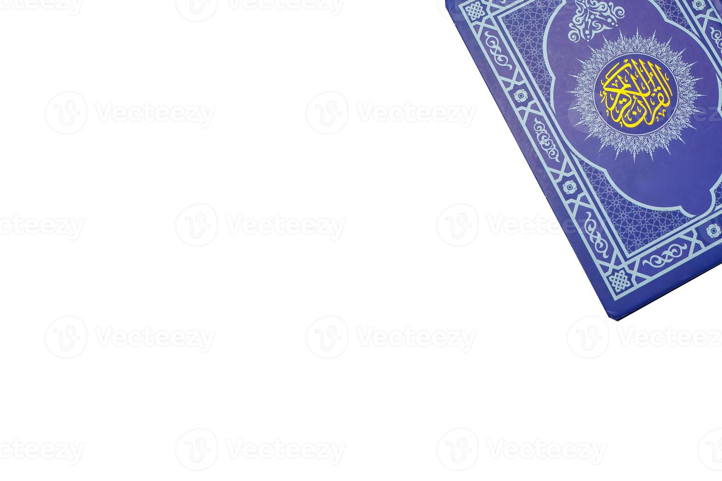 Holy Al Quran with written arabic calligraphy on white background with copy space photo