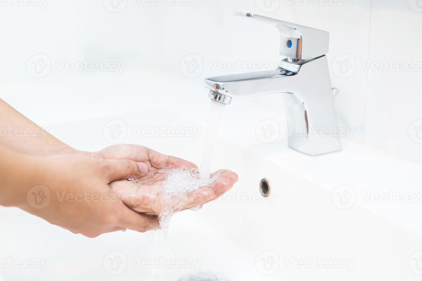 Wash your hands to prevent germs. photo