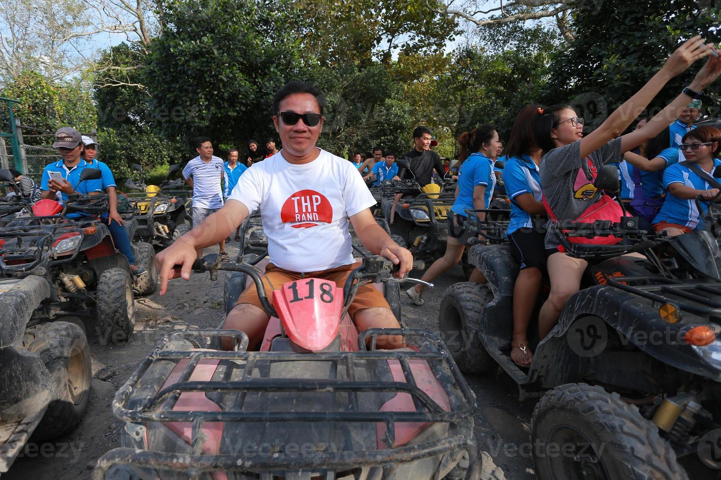 NAKHONNAYOK, THAILAND - DECEMBER 19 Tourists riding ATV to nature adventure on dirt track on DECEMBER 19, 2015, Thailand. photo
