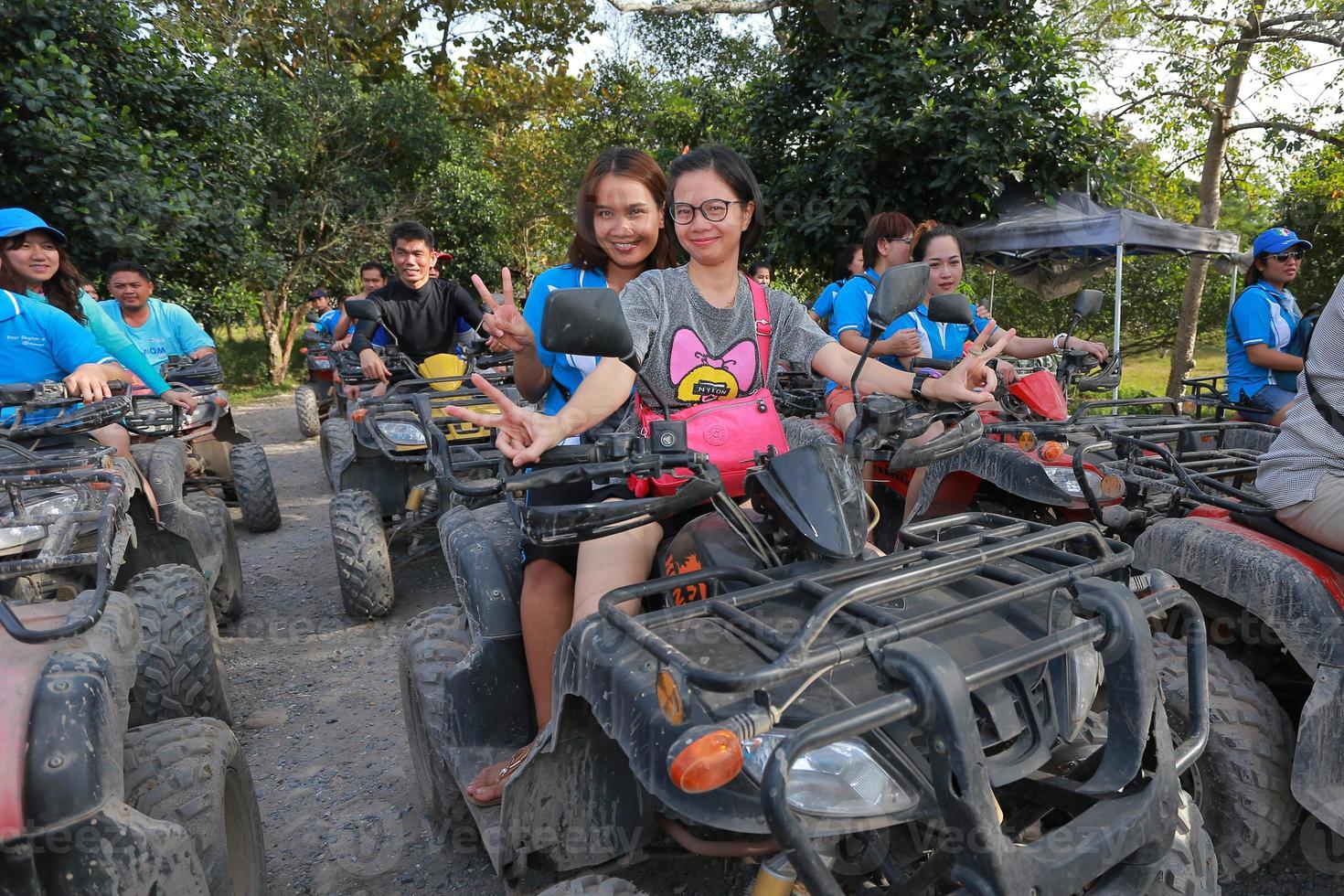 NAKHONNAYOK, THAILAND - DECEMBER 19 Tourists riding ATV to nature adventure on dirt track on DECEMBER 19, 2015, Thailand. photo