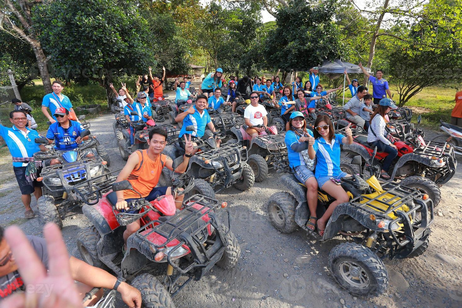 NAKHONNAYOK, THAILAND - DECEMBER 19 Tourists riding ATV to nature adventure on dirt track on DECEMBER 19, 2015, Thailand. photo