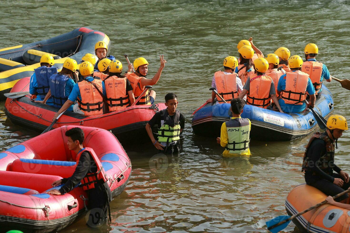 NAKHONNAYOK, THAILAND,DECEMBER 19  Group of adventurer doing white water rafting at dam, on December 19, 2015,The river is popular for its scenic nature view. photo