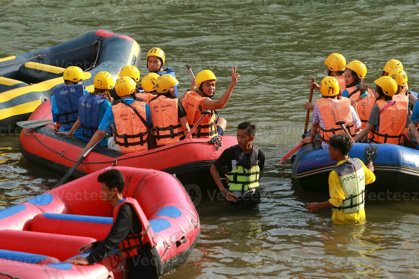 NAKHONNAYOK, THAILAND,DECEMBER 19  Group of adventurer doing white water rafting at dam, on December 19, 2015,The river is popular for its scenic nature view. photo