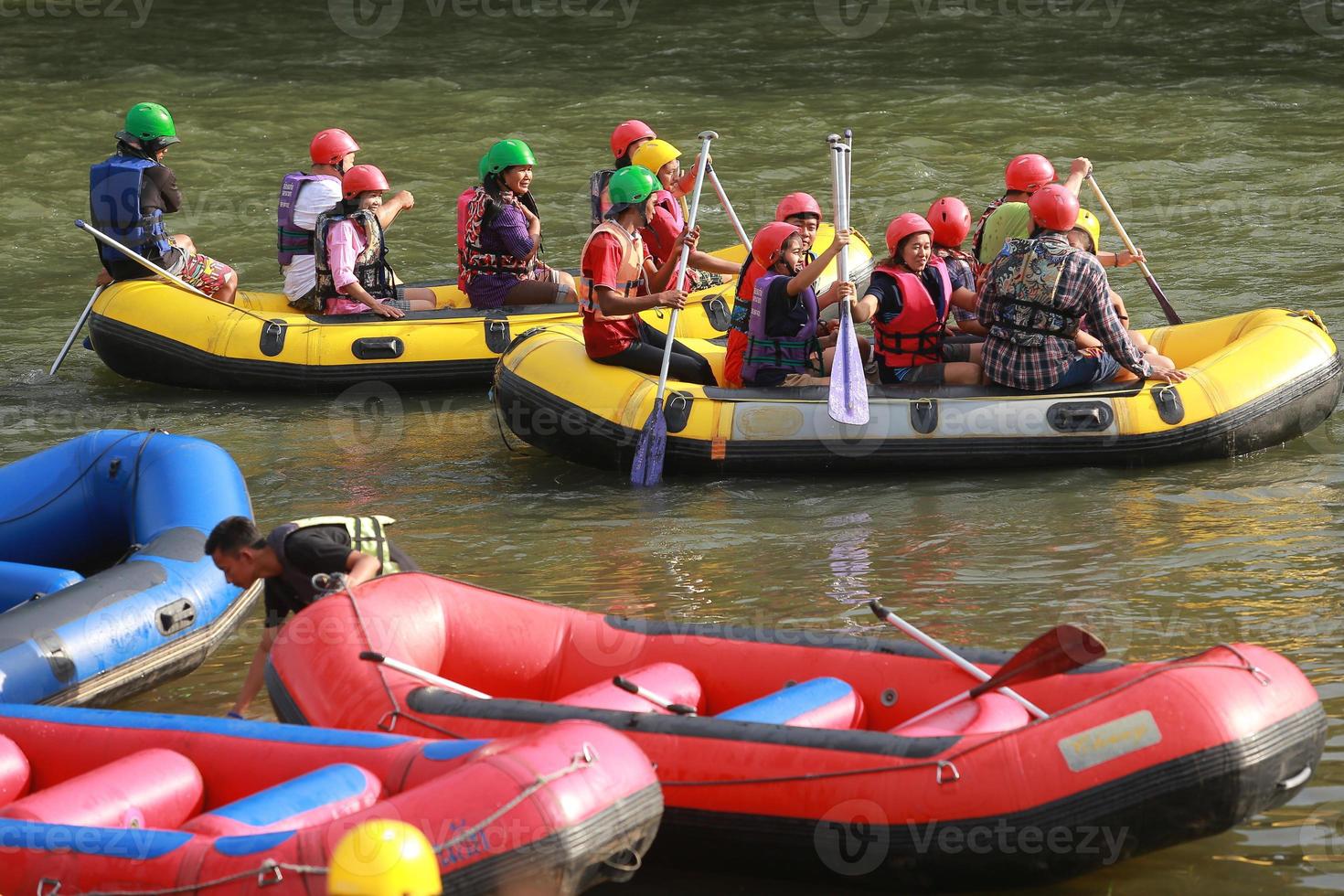 NAKHONNAYOK, THAILAND,DECEMBER 19  Group of adventurer doing white water rafting at dam, on December 19, 2015,The river is popular for its scenic nature view. photo