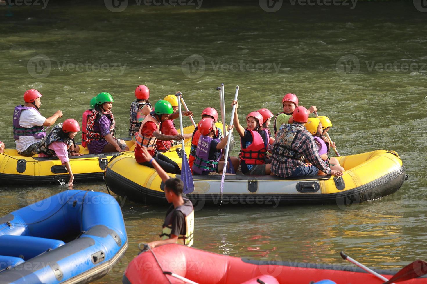 NAKHONNAYOK, THAILAND,DECEMBER 19  Group of adventurer doing white water rafting at dam, on December 19, 2015,The river is popular for its scenic nature view. photo