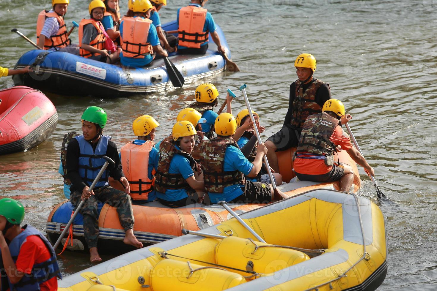 NAKHONNAYOK, THAILAND,DECEMBER 19  Group of adventurer doing white water rafting at dam, on December 19, 2015,The river is popular for its scenic nature view. photo