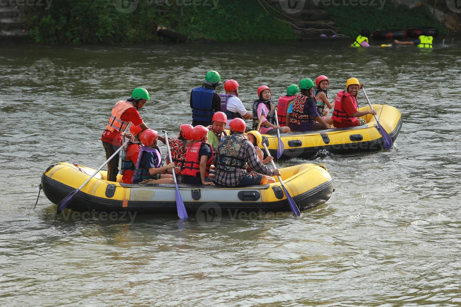 NAKHONNAYOK, THAILAND,DECEMBER 19  Group of adventurer doing white water rafting at dam, on December 19, 2015,The river is popular for its scenic nature view. photo