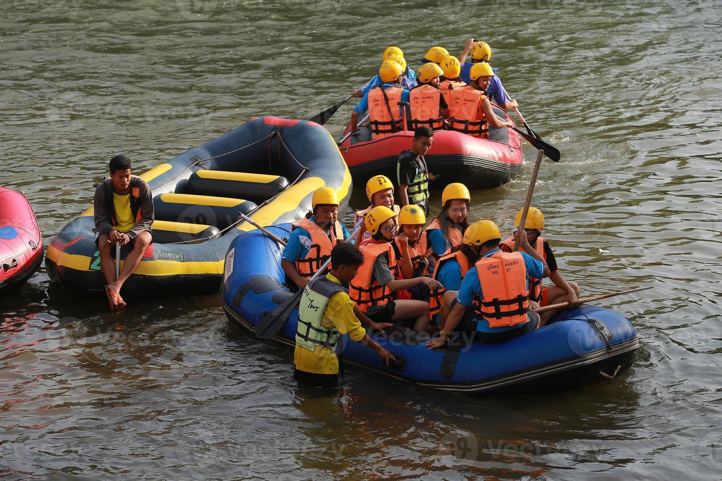 NAKHONNAYOK, THAILAND,DECEMBER 19  Group of adventurer doing white water rafting at dam, on December 19, 2015,The river is popular for its scenic nature view. photo