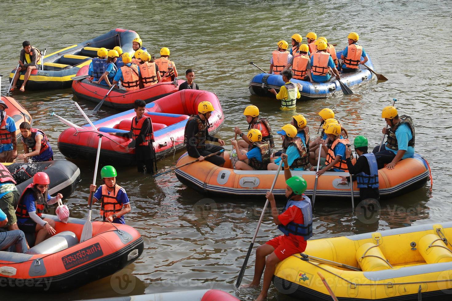NAKHONNAYOK, THAILAND,DECEMBER 19  Group of adventurer doing white water rafting at dam, on December 19, 2015,The river is popular for its scenic nature view. photo