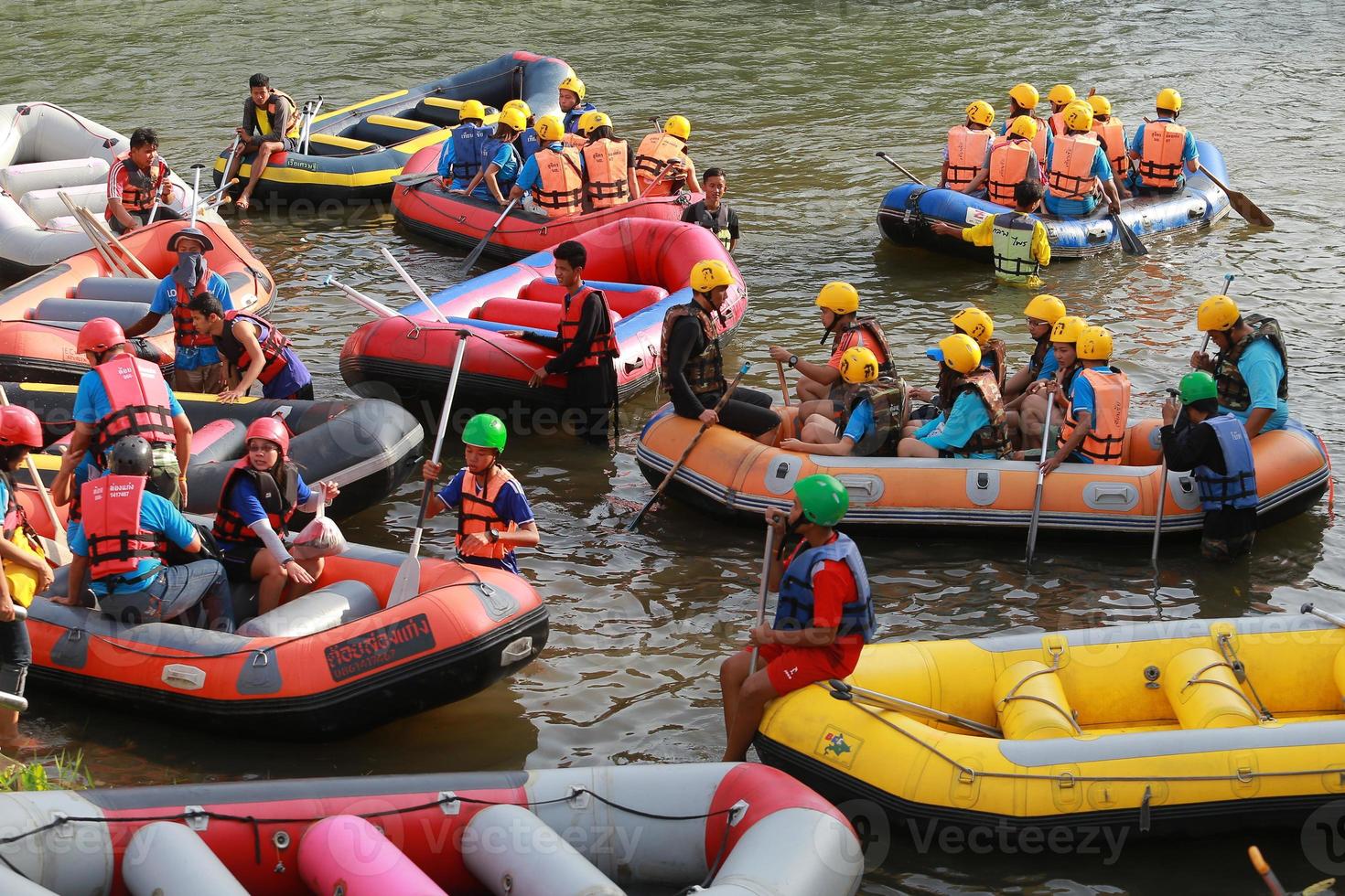 NAKHONNAYOK, THAILAND,DECEMBER 19  Group of adventurer doing white water rafting at dam, on December 19, 2015,The river is popular for its scenic nature view. photo