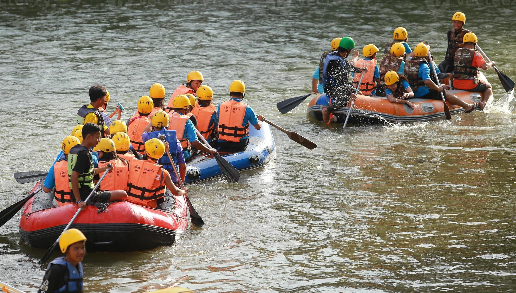 NAKHONNAYOK, THAILAND,DECEMBER 19  Group of adventurer doing white water rafting at dam, on December 19, 2015,The river is popular for its scenic nature view. photo