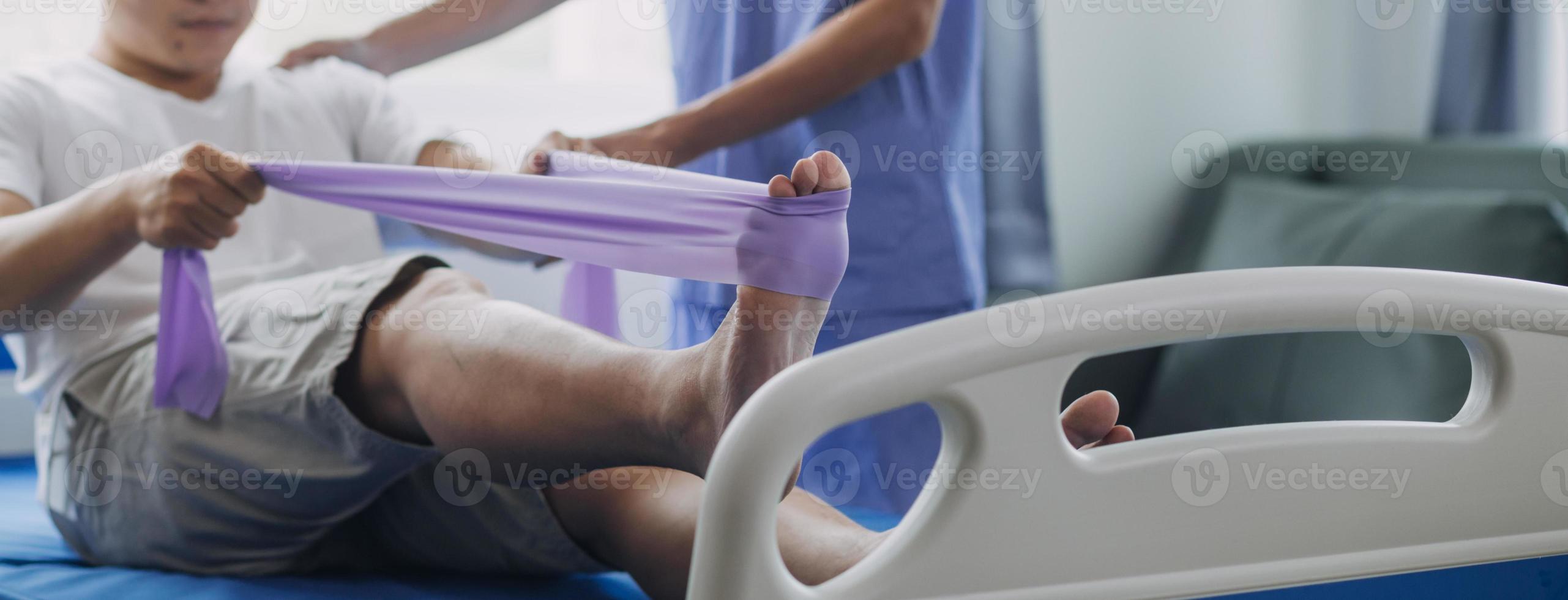 Doctor or Physiotherapist working examining treating injured arm of athlete male patient, stretching and exercise, Doing the Rehabilitation therapy pain in clinic. photo