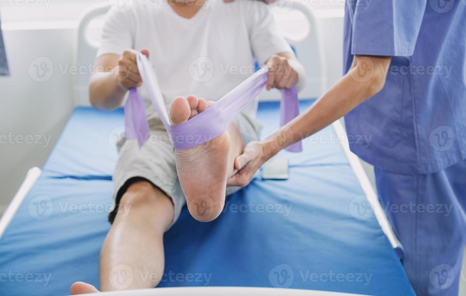 Doctor or Physiotherapist working examining treating injured arm of athlete male patient, stretching and exercise, Doing the Rehabilitation therapy pain in clinic. photo