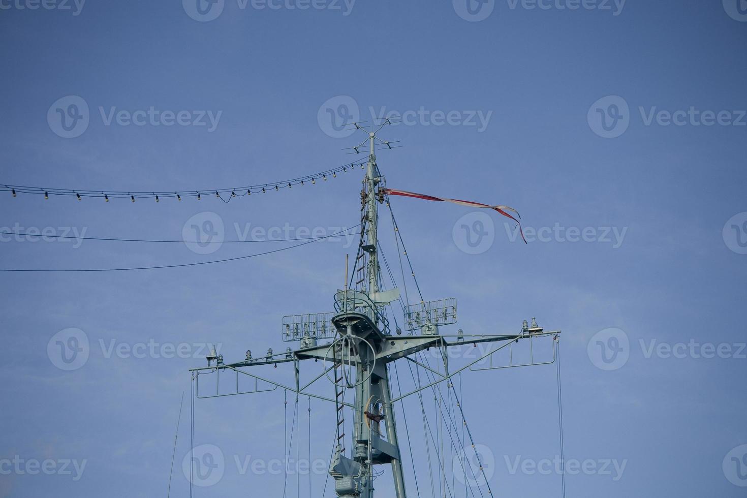 warship mast against the blue sky photo