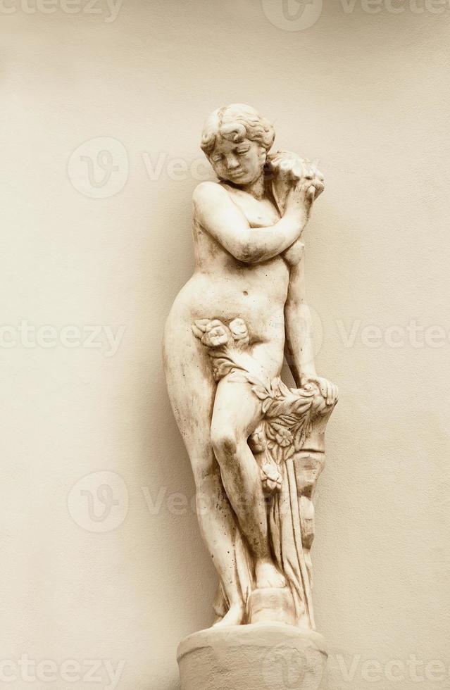 beige woman statuette in ancient style photo