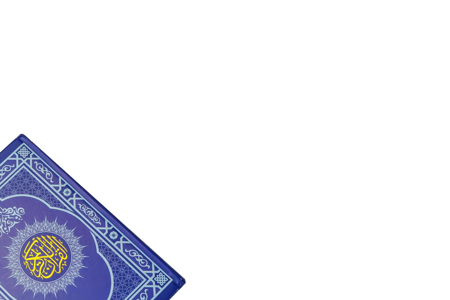 Holy Al Quran with written arabic calligraphy on white background with copy space photo