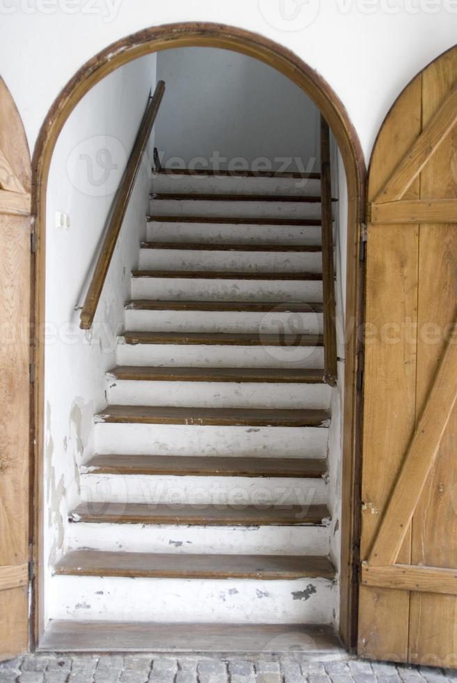 antique staircase in the doorway of the castle photo