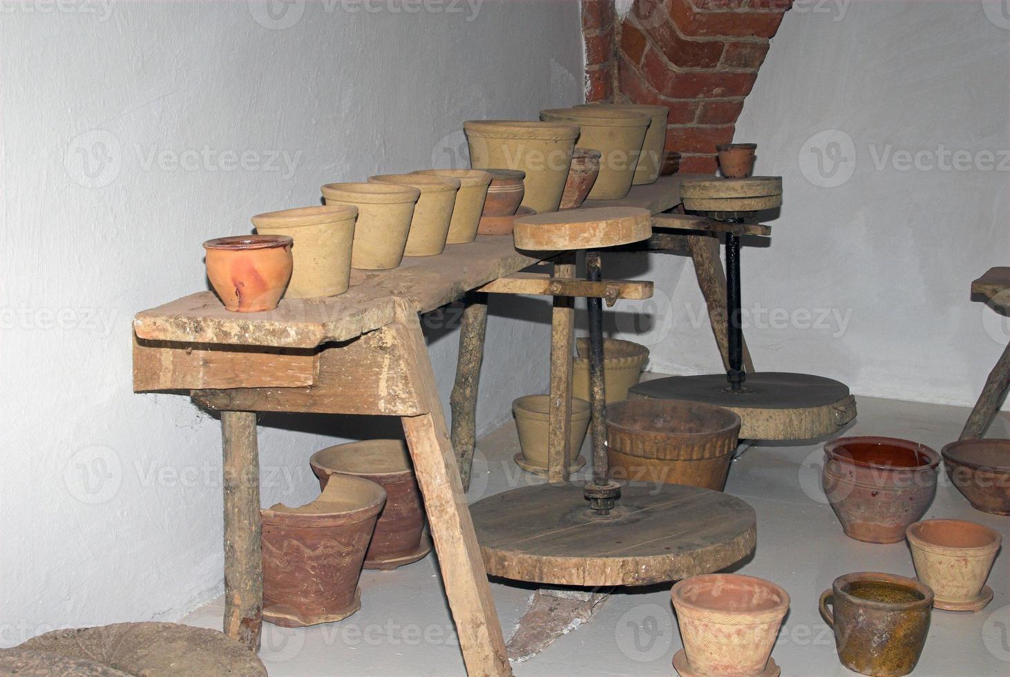 pottery workshop with clay pots in a room in the museum photo