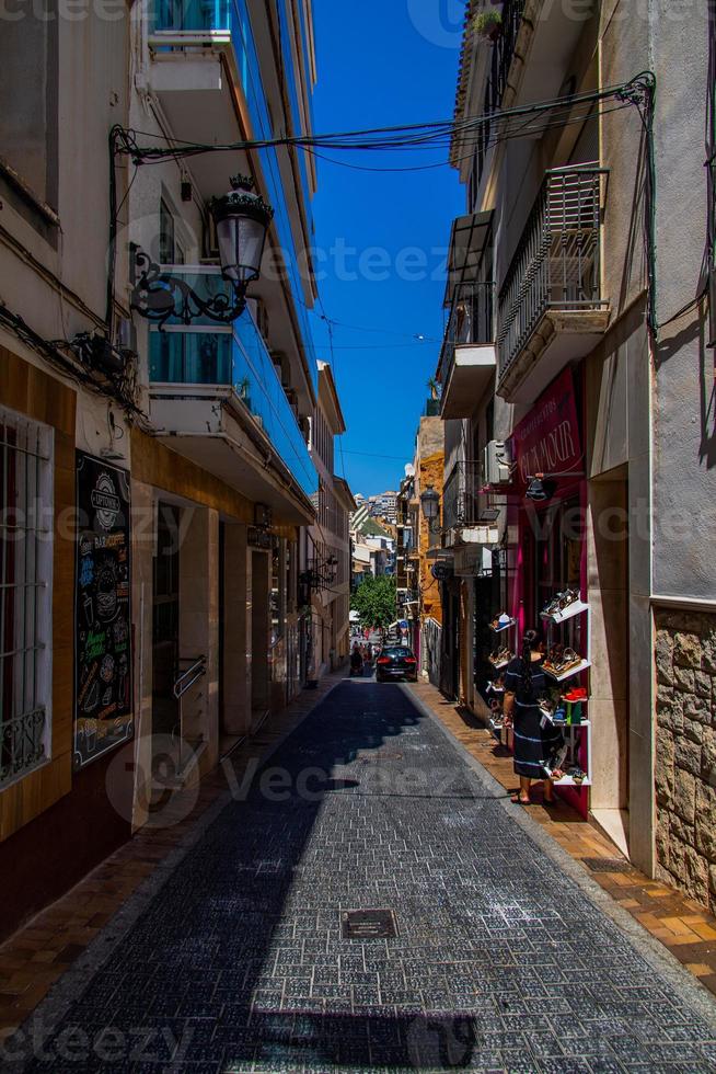 narrow streets in the old town of Benidorm, Spain on a warm summer day photo