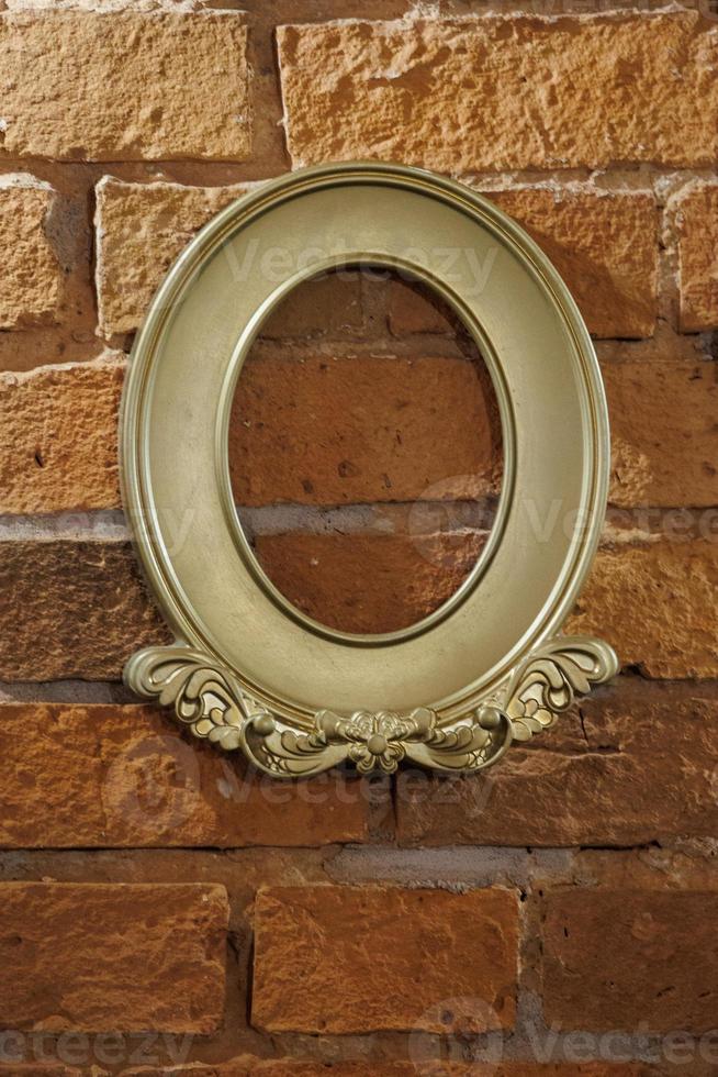 golden retro frame on brick red wall background photo