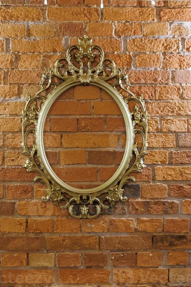 golden retro frame on brick red wall background photo