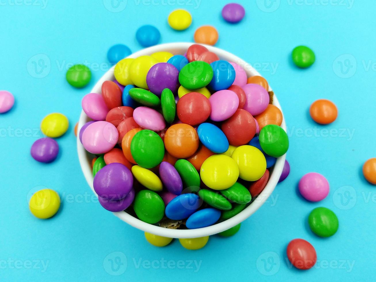 Chocolate Candy Gems on blue photo