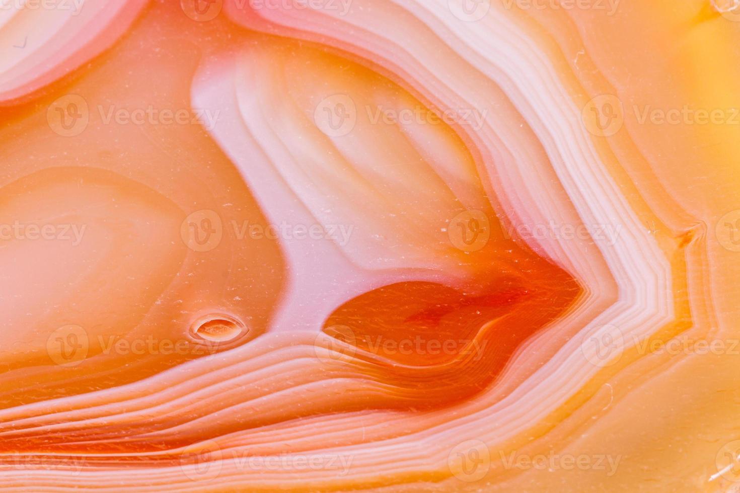 Macro mineral orange agate in crystals on white background photo