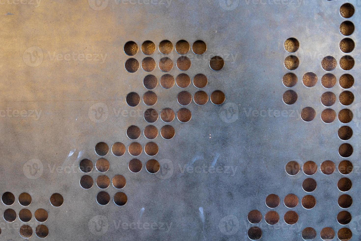 metal industrial silver background with round holes photo