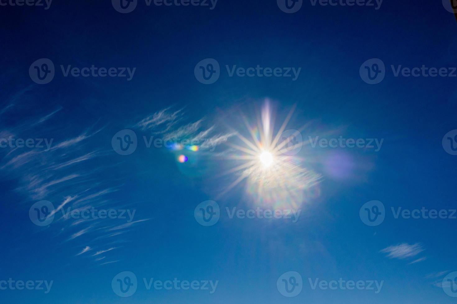 natural landscape background with blue sky, sun and white clouds photo