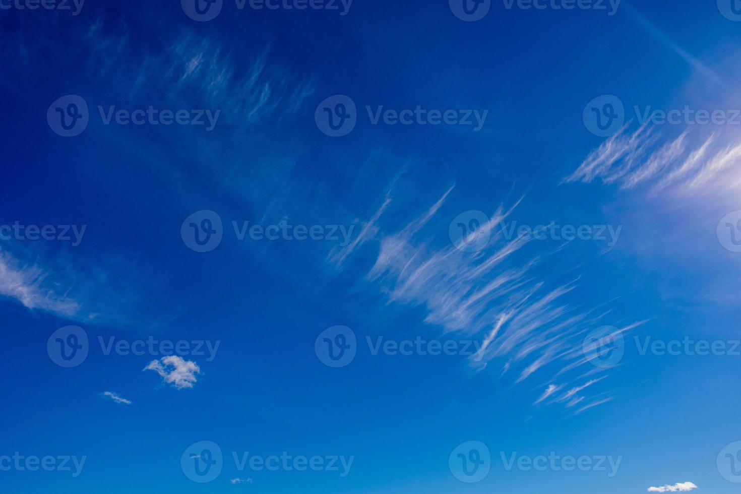 natural landscape background with blue sky, sun and white clouds photo