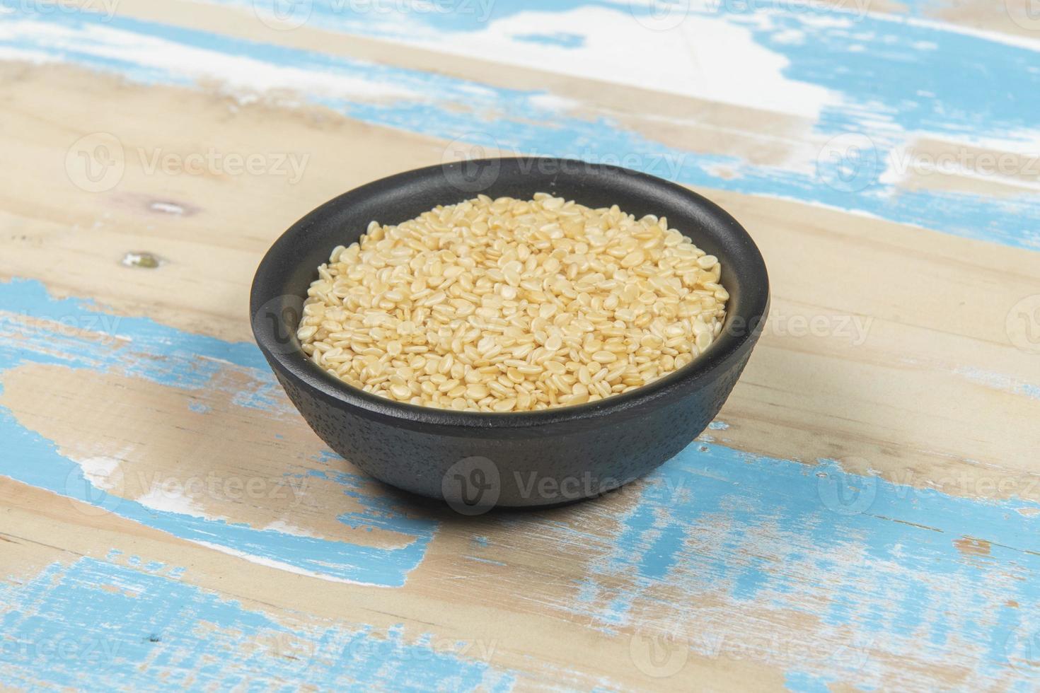 bowl with chickpea on blue rustic wooden table photo