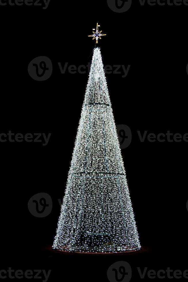 glowing christmas tree decoration on black background photo