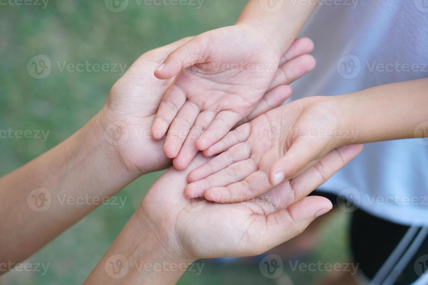 Mother holding son's hand to encourage and warm photo