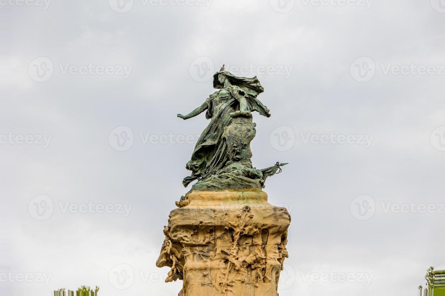 interesting monument in Zaragoza in a park on a cloudy day photo