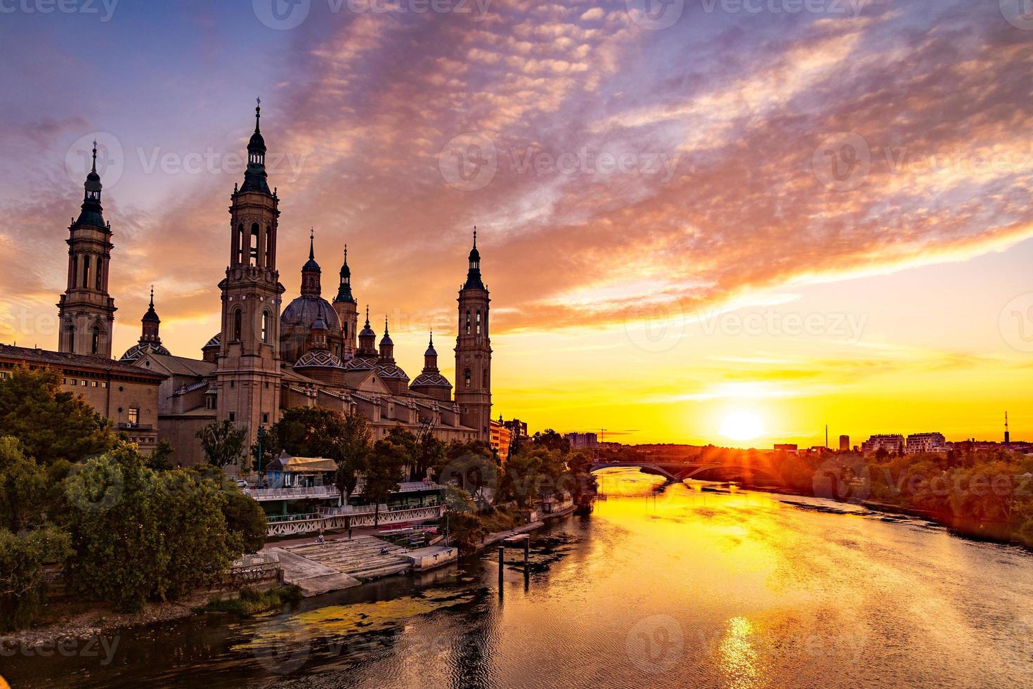 picturesque sunset on a summer day in the city of Zaragoza in Spain overlooking the river and the cathedral photo