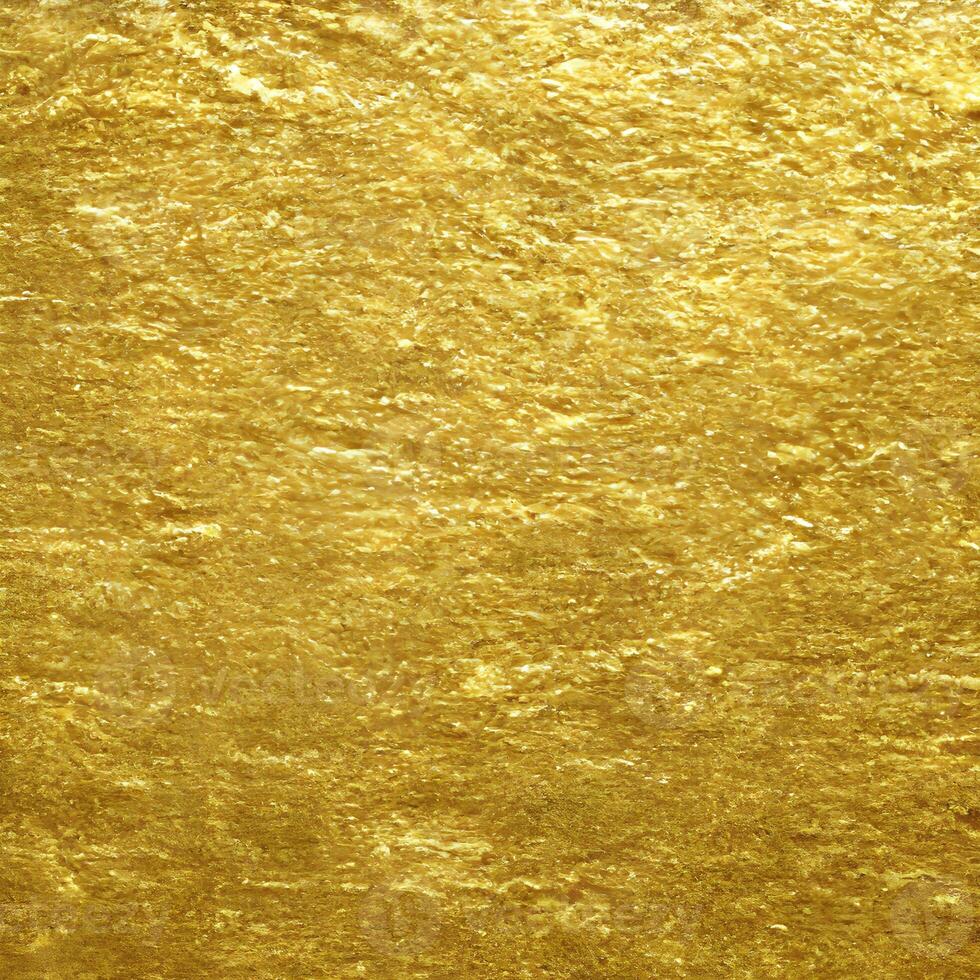 gold texture background. close up of shiny surface of gold. golden smooth material. gold leaf. . photo