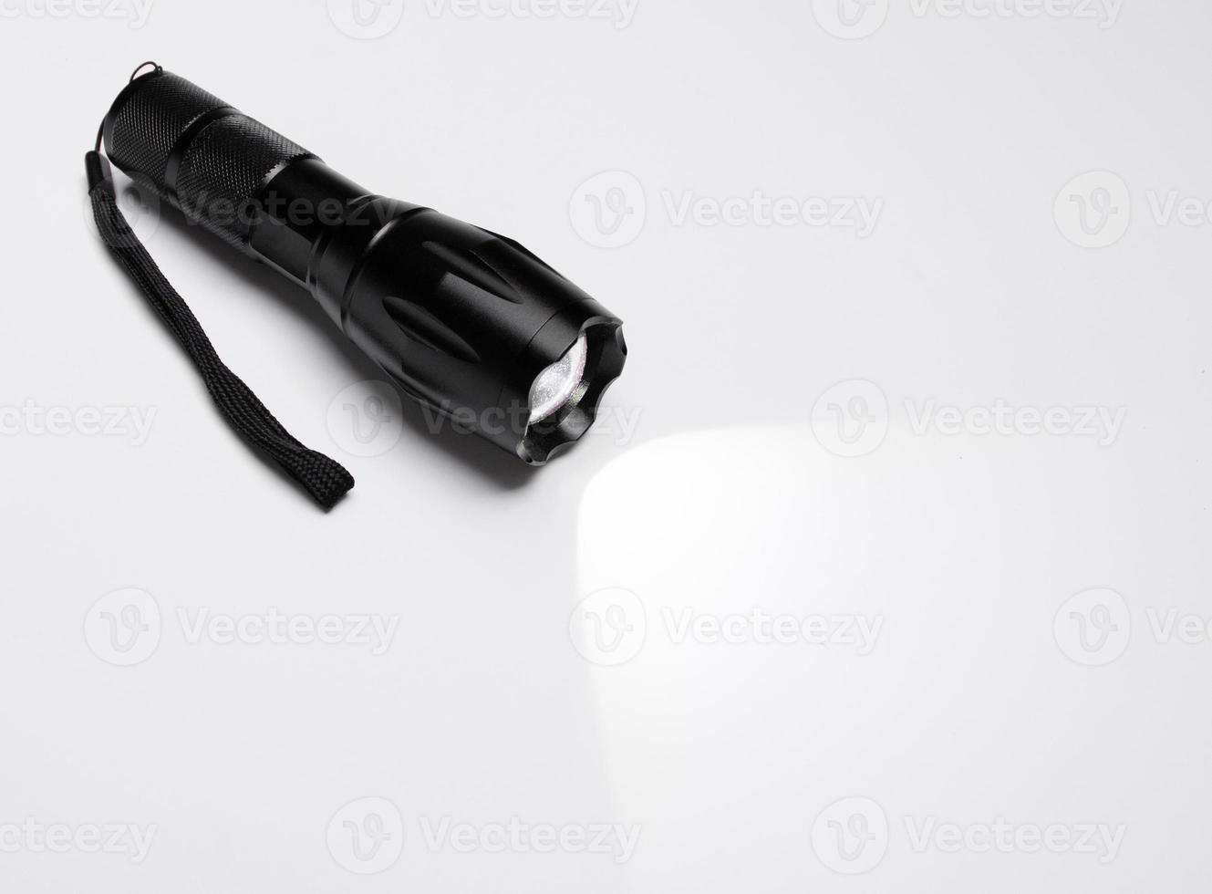 A flashlight isolated on white background. photo