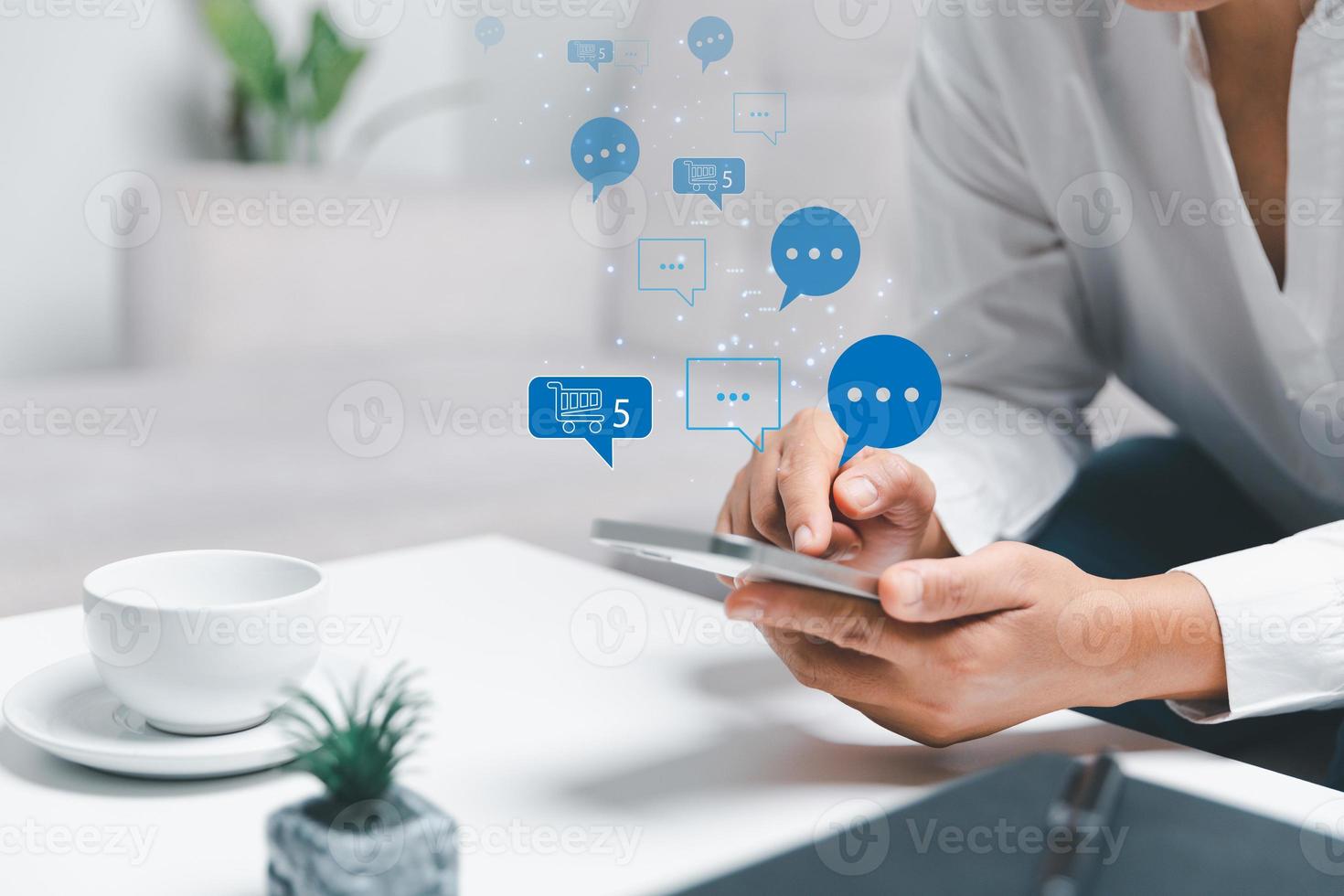 Business woman using smart phone with social network service or SNS, Social media concept. Woman using laptop computer and staying at home for online marketing business. social media business. photo