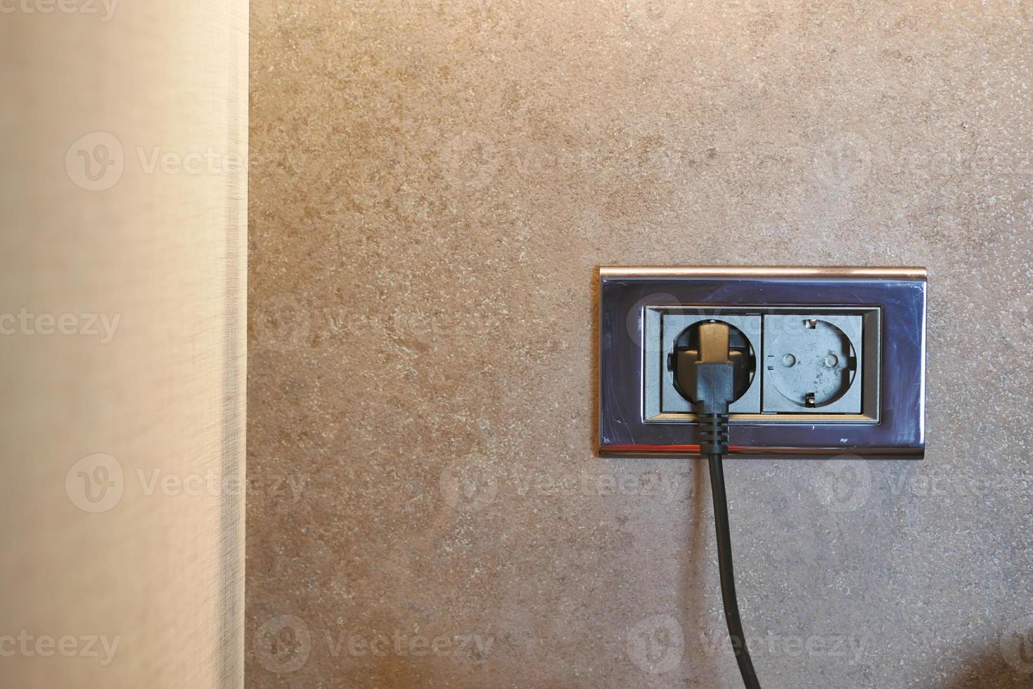 Electrical switch and plug on table photo