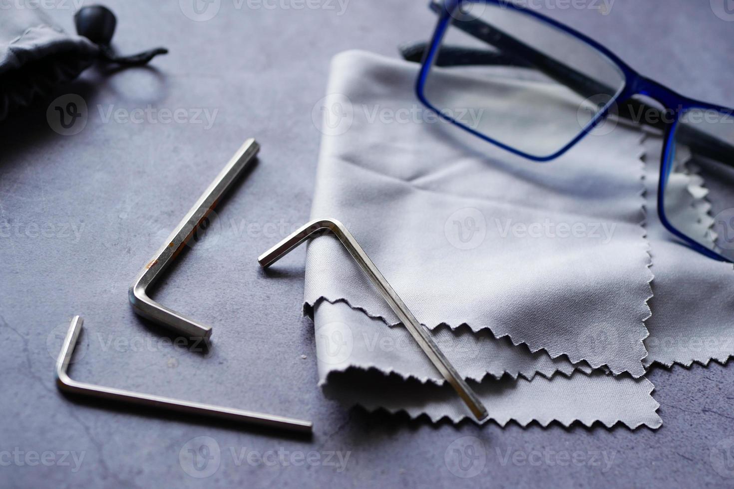 eyewear repair equipment with an eyeglass frame, photo