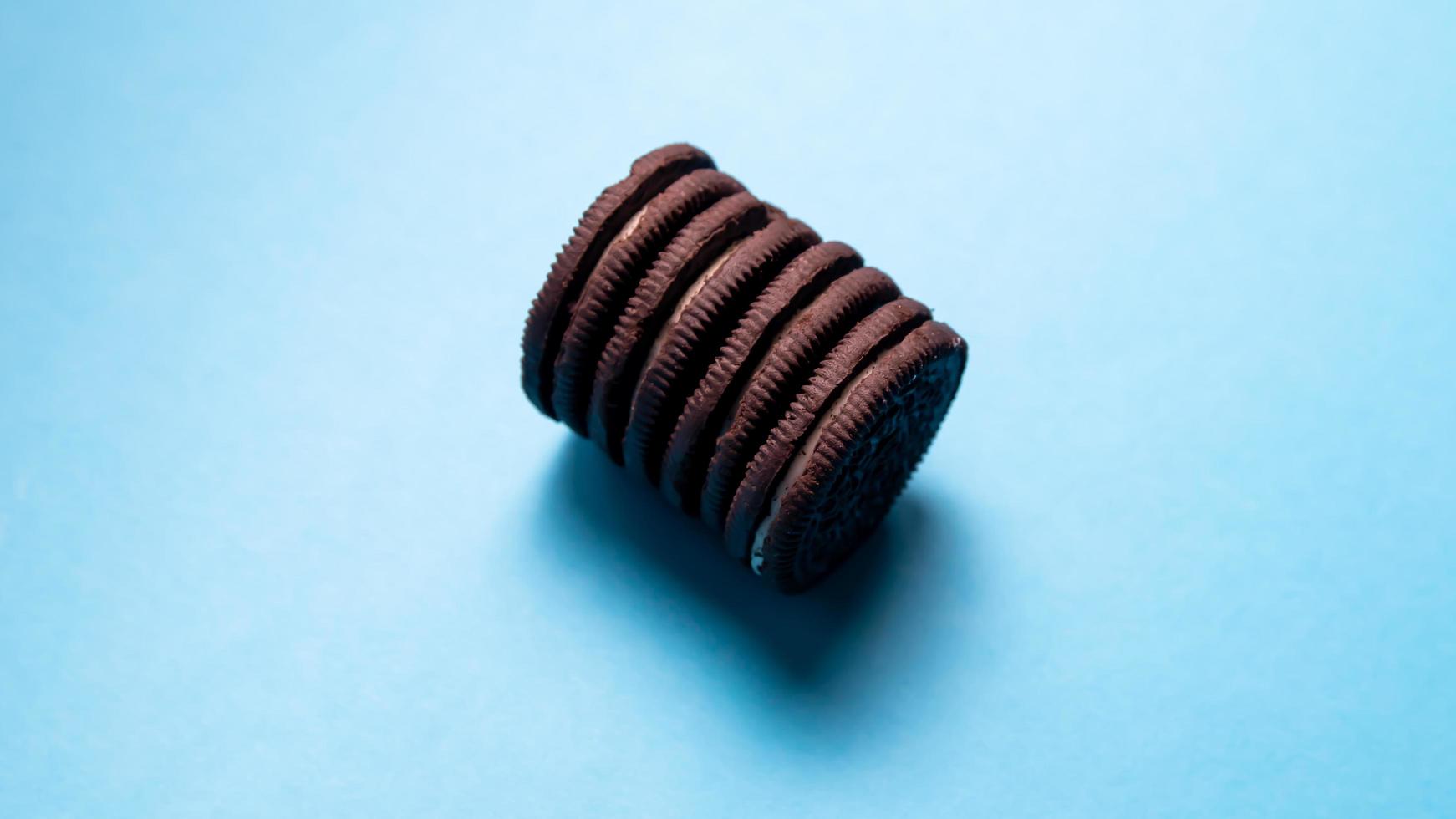 Chocolate cookies on a blue background. Oreo. Top view. Copy space. photo