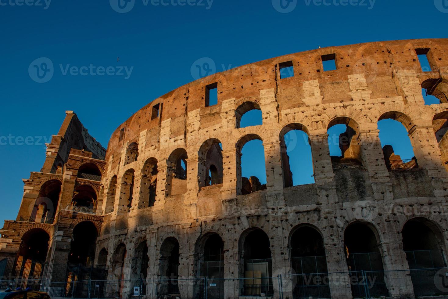 Colosseum, originally known as the Flavian Amphitheater . Located in the city center of Rome, it is the largest Roman amphitheater in the world photo